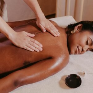 Woman Lying on a Massage Table and Getting a Massage