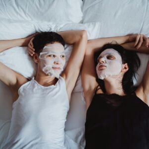 Couple in Bed with Face Masks