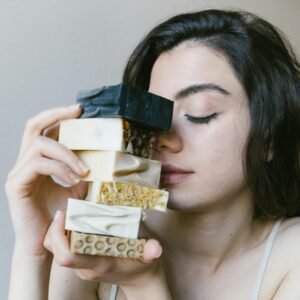 A Woman Holding Soap Bars